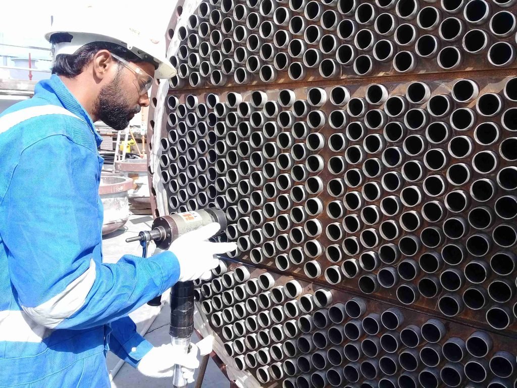 Technicians working on heat exchanger