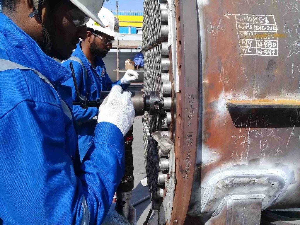 Tube sheet with technician inserting probe