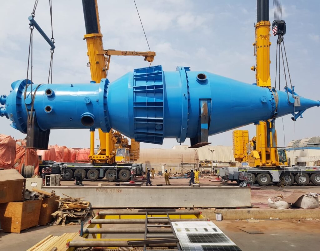 Long cylindrical tank on flatbed trailer