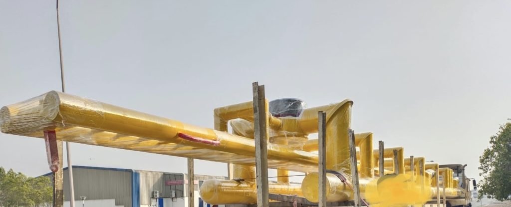 Fabricated yellow offshore platform module in a fabrication yard.