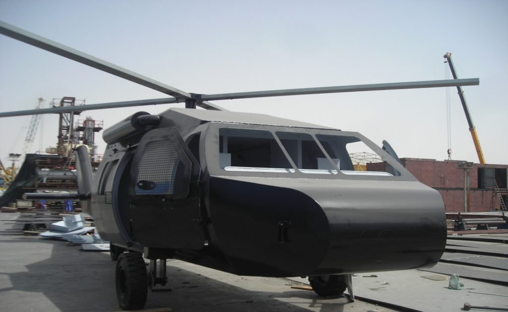 Black helicopter parked on ground