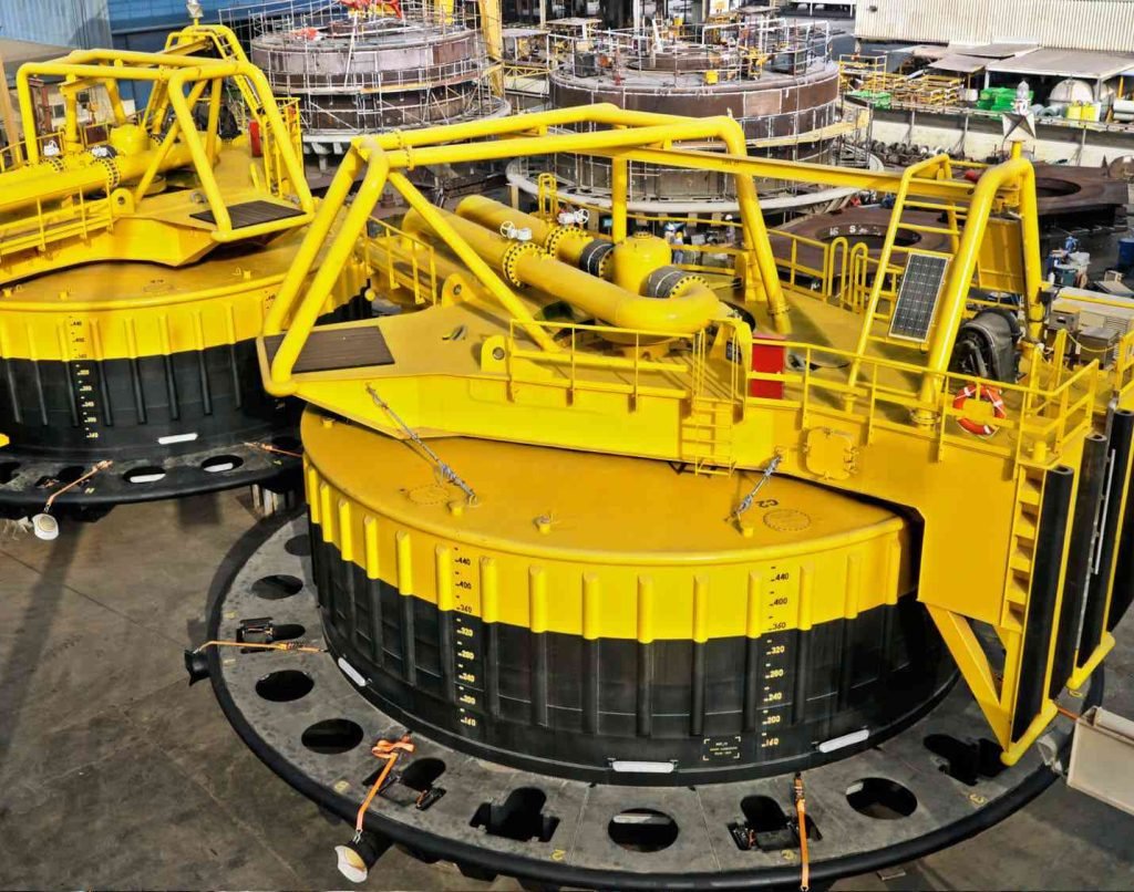 Top-down view of large yellow offshore carousel system