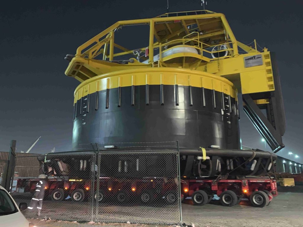 Massive round offshore module loaded for transportation