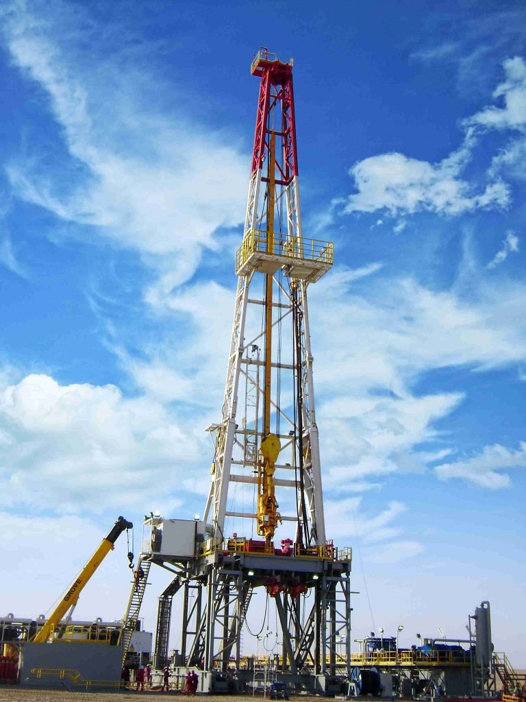 Oil rig with red and yellow tower