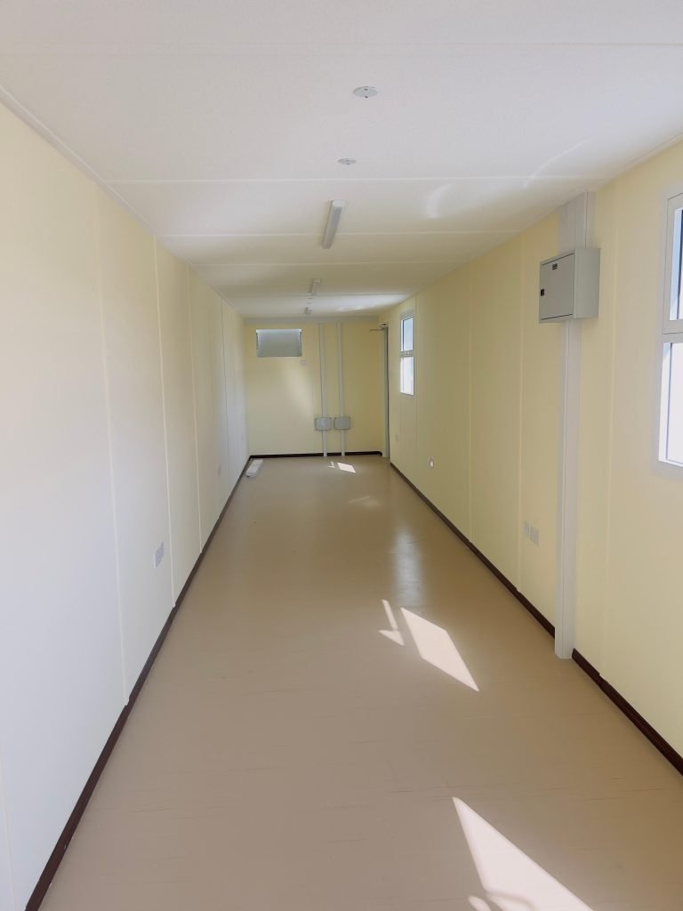 Long corridor inside prefab unit