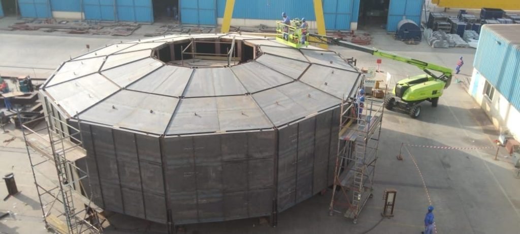 White carousel base section under construction at yard