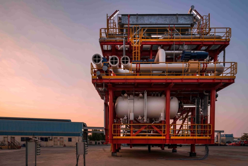 Elevated modular equipment unit on a platform.