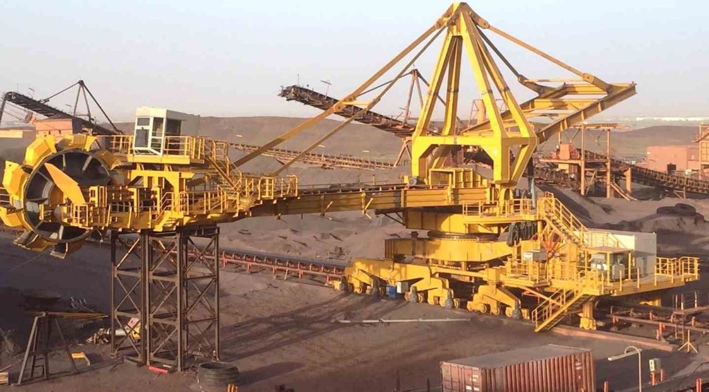 Yellow mining machinery in desert