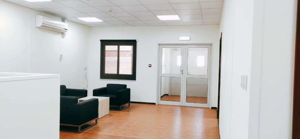 Office reception with black couches