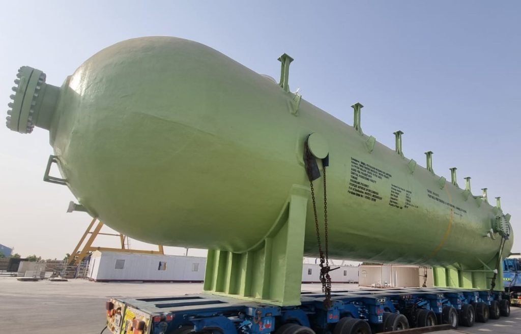 Large horizontal green industrial tank
