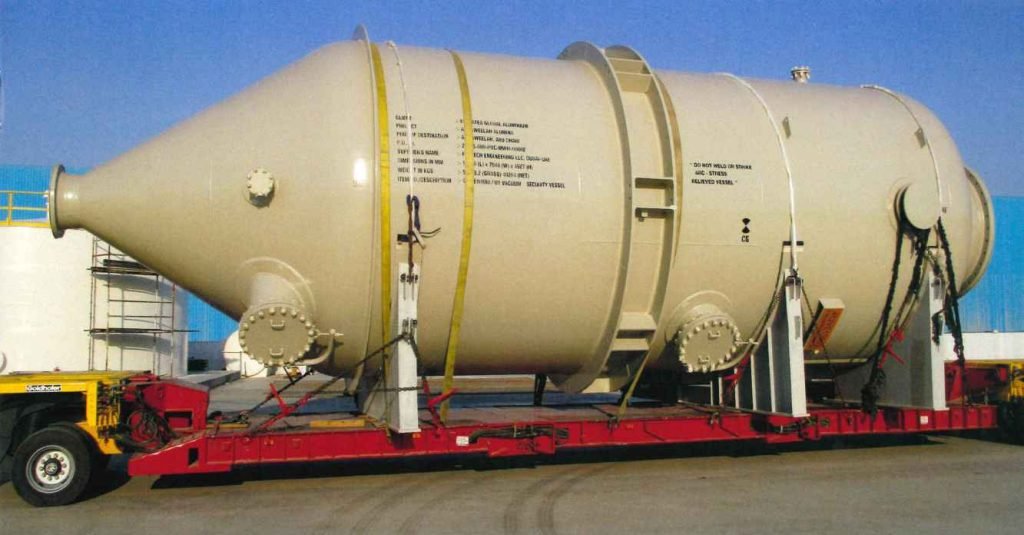 Large yellow pressure vessel on trailer
